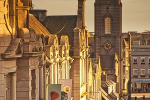 Captivating view of Aberdeen's historic architecture and church at sunset.